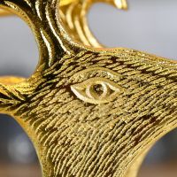 Close up embossed detailing around stag"s head and eye 