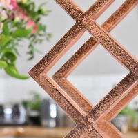 Close up of Copper "Geometric" Wine Rack 