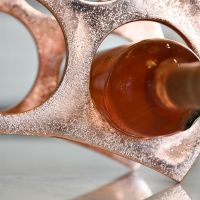 Close up of wine rack with bottle in situ 