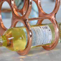 Close up of Wine Rack with Wine Bottle in Holder Close up of Wine Rack with Wine Bottle in Holder