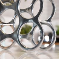 Close up of circular wine rack on kitchen countertop  Close up of circular wine rack on kitchen countertop