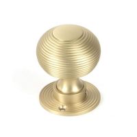 Close-Up of Satin Brass "Beehive" Mortice & Rim Doorknob Set