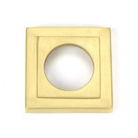 Close-Up of Square Backplate on Satin Brass "Royale" Square Concealed Door Handle on Rose Set Close-Up of Square Backplate on Satin Brass "Royale" Square Concealed Door Handle on Rose Set