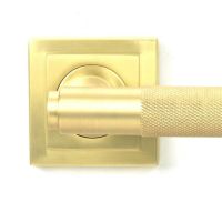 Close-Up of Satin Brass "Royale" Square Unsprung Door Handle on Rose Set Close-Up of Satin Brass "Royale" Square Unsprung Door Handle on Rose Set