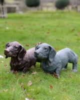 "Rolo" the Sausage Dog Cast Aluminium Garden Sculpture - Copper stood next to verdigris version