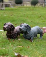 "Rolo" the Sausage Dog Cast Aluminium Garden Sculpture - Copper to scale with hand in shot for reference