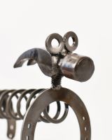 Close up of face detail on dog scrap metal art