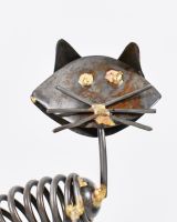 Close up of cat face detail on scrap metal art sculpture