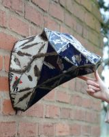 ‘Glacier’ the Bear Head Mount Wall Art mounted on brick wall to scale with hand for reference