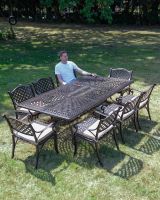 The "Highgrove" 8-Seater Luxury Garden Dining Set - Antique Copper Cushion Scale Shot In A Garden The "Highgrove" 8-Seater Luxury Garden Dining Set - Antique Copper Cushion Scale Shot In A Garden