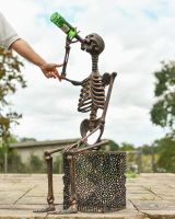 Scale image of copper skeleton garden statue