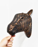 Scale image of copper animal head wall bust