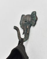 In situ photo of verdigris animal coat hook In situ photo of verdigris animal coat hook