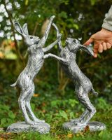 Scale image of pewter boxing hares garden statue Scale image of pewter boxing hares garden statue