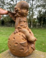 Scale image of rustic cast iron young fairy with strawberry garden sculpture Scale image of rustic cast iron young fairy with strawberry garden sculpture