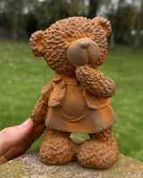 Scale image of rustic finish cast iron bear garden statue Scale image of rustic finish cast iron bear garden statue