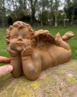 Scale image of Rustic Cast Iron Cherub Garden Sculpture Scale image of Rustic Cast Iron Cherub Garden Sculpture