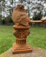 Scale image of rustic finish robin garden sculpture