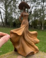 Scale image of rustic cast iron dancing lady garden statue