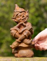 Scale of Cast Iron Cheeky Elf Sculpture Scale of Cast Iron Cheeky Elf Sculpture