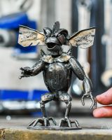 Scale image of scrap metal home decor sculpture