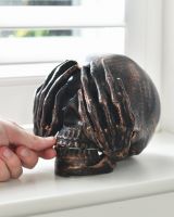 scale of bronze skull ornament scale of bronze skull ornament