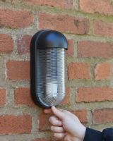 Scale Of The Contemporary Black "Hurley" Cylinder Wall Light 