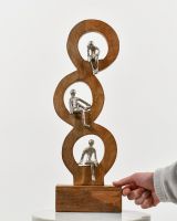 Scale image of cast aluminium and mango wood home decor sculpture