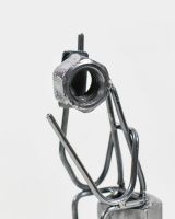 Close up of Phone Call Sitting Scrap Metal Ornament head