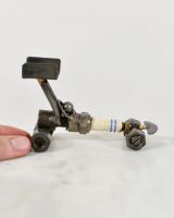 Scale image of Spark Plug Drag Car Scrap Metal Sculpture Scale image of Spark Plug Drag Car Scrap Metal Sculpture