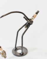 Close up of Spark Plug Fishing Recycled Metal Ornament Fisher made from a spark plug 