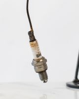 Close up of Spark Plug Fishing Recycled Metal Ornament Hook made from a spark plug