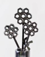 Close up of Scrap Metal Flower Pot Sculpture flower heads Close up of Scrap Metal Flower Pot Sculpture flower heads