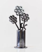 Scrap Metal Flower Pot Sculpture side view Scrap Metal Flower Pot Sculpture side view