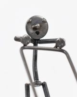 Close up of Mowing Scrap Metal Sculpture face