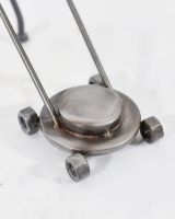 Close up of Mowing Scrap Metal Sculpture mower