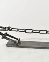 Close up of "Tug Of War" Scrap Metal Sculpture chain