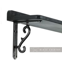 Black Scroll Shelf Bracket in Situ Holding a Wooden Shelf