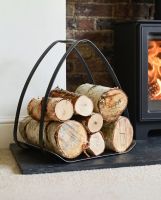 The "The Ternion" Contemporary Log Holder on a Black Stone Hearth next to Lit Log Burner - Digital Illustration The "The Ternion" Contemporary Log Holder on a Black Stone Hearth next to Lit Log Burner - Digital Illustration