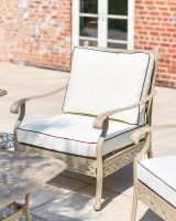 Close up shot of the single seater chair with cushions.