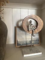 In situ photo of silver aluminium, mango wood and marble art sculpture