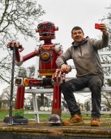 Scale image of garden selfie bench with recycled metal robot