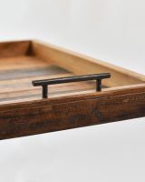 Close up of handle detail on rustic serving tray