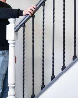 Scale Shot of Set of 2 Matte Black "Enfield" Steel Stair Spindles - Pattern 12