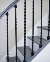 Close-Up of Set of 2 Matte Black "Enfield" Steel Stair Spindles - Pattern 12