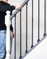 Scale Shot of Set of 2 Matte Black "Enfield" Steel Stair Spindles - Pattern 15