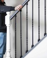 Scale Shot of Set of 2 Matte Black "Enfield" Steel Stair Spindles - Pattern 4