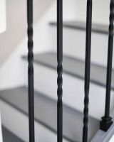 Close-Up of Set of 2 Matte Black "Enfield" Steel Stair Spindles - Pattern 4 in Situ