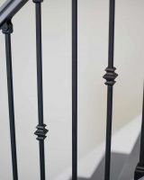 Close-Up of Set of 2 Matte Black "Enfield" Steel Stair Spindles - Pattern 8 in Situ