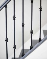 Close-Up of Set of 2 Matte Black "Enfield" Steel Stair Spindles - Pattern 9 in Situ